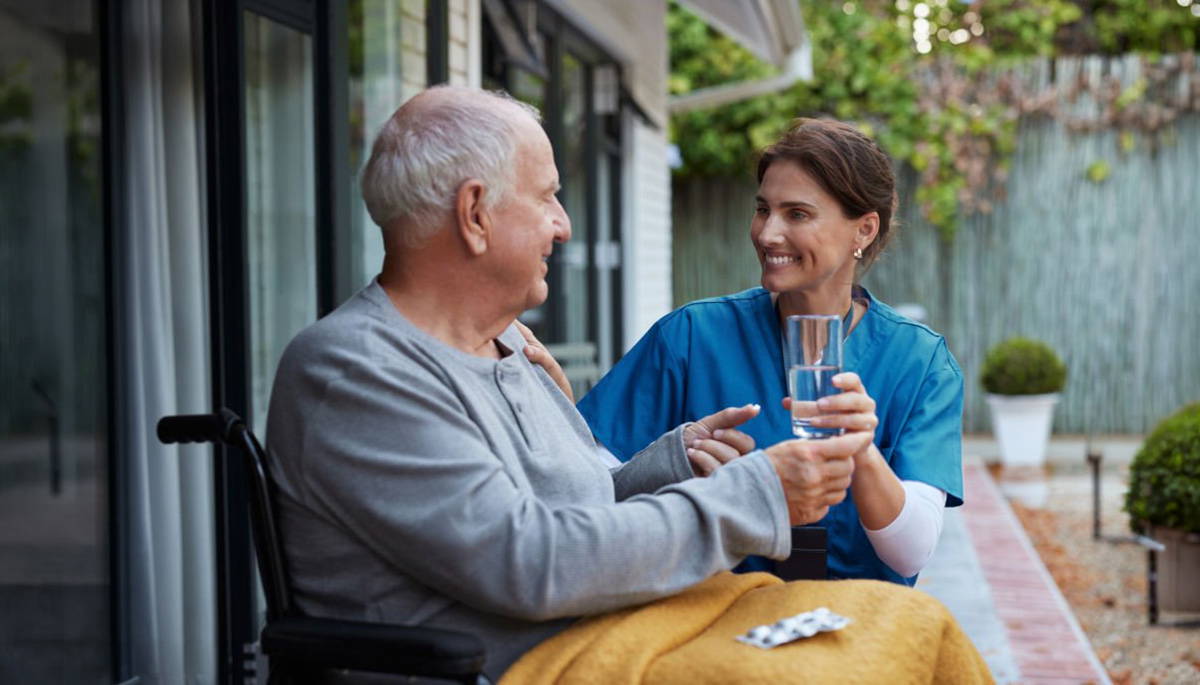 care nurse at home with a patient